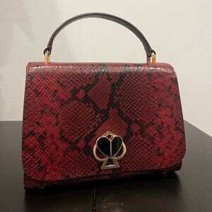 kate spade burgundy nicola snake embossed twistlock small top handle bag